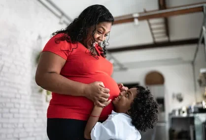 pregnant adult with child